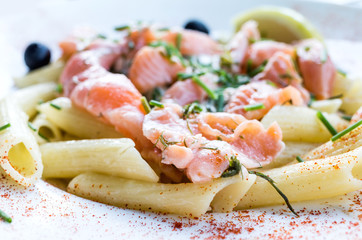 tasty pasta with salmon on a the table