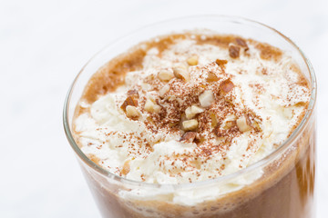 festive spiced pumpkin latte and almond cookies, closeup