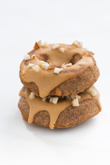 homemade baked donuts with icing, vertical, selective focus