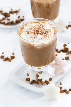 festive pumpkin latte and almond cookies on a white background