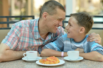 father with son at breakfast
