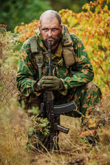 Fototapeta premium russian soldier in the battlefield with a rifle