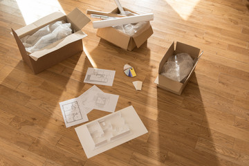 top view, in a new house, a model is laying on the floor