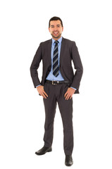 hispanic man standing in a suit