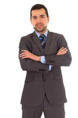 man crossing arms standing in a suit
