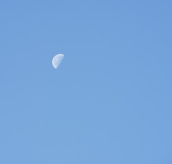 Moon in blue sky background