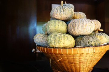 Fresh pumpkins in a wicker basket