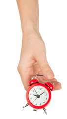 Humans hand holding alarm clock