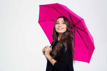 Beautiful woman holding umbrella and looking up © Drobot Dean
