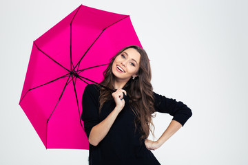 Portrait of a smiling woman holding umbrella © Drobot Dean