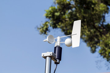 Anemometer and Devices meteorological station on the blue sky ba