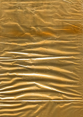 Crumpled golden wrapping paper