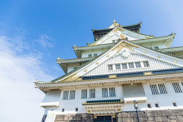 Fototapeta premium Osaka castle in Japan with clear blue sky