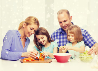 happy family with two kids making dinner at home