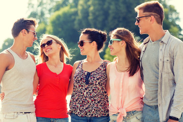 group of smiling friends in city