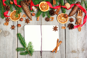 Christmas decoration with fir tree, oranges, cones, spices