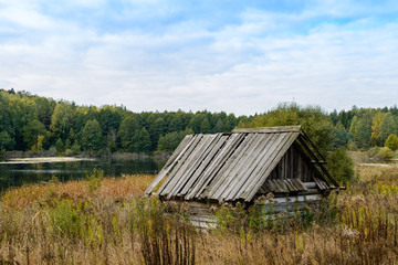 Autumn landscape. Old abandoned village on the empty field. Dete