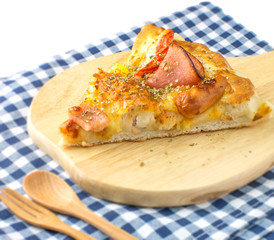hawaiian pizza on wood dish