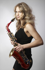 Sexy attractive women with saxophone