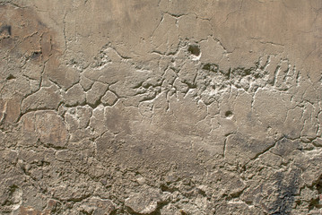 old chipped plaster on the concrete wall texture background