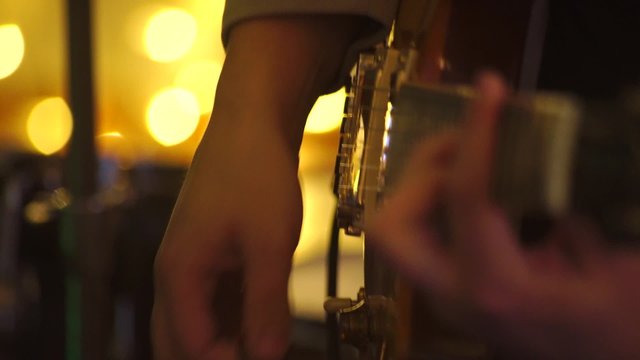 guy playing the electric guitar at the party