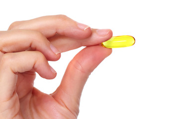 Woman hand with pill.