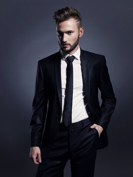 Handsome stylish man in black suit