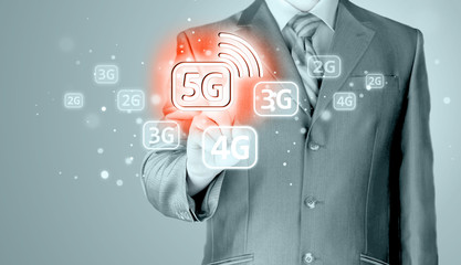 businessman holding in hand 5G, technology background