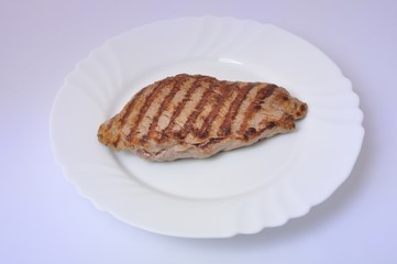 Grilled beef steak on plate