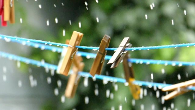 Clips/clothspin hanging in rain