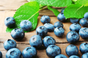 Fresh blueberries on wooden table, closeup
