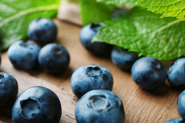 Fresh blueberries on wooden table, closeup