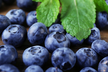 Fresh blueberries on wooden table, closeup