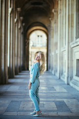 Fototapeta na wymiar Beautiful young woman in Paris, near the louvre