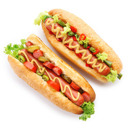 A pair of fresh hot dogs isolated on white