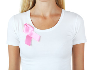Woman using pink ribbon on her chest isolated on white