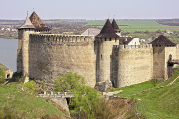 Fototapeta na wymiar The medieval castle with lots of towers and battlements is in th