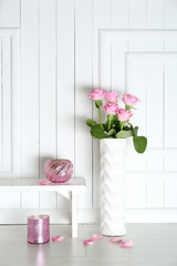 Home decor and roses on wooden background