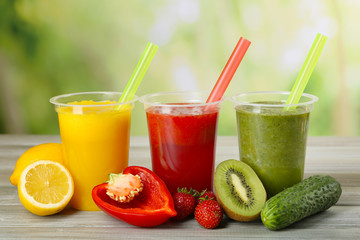 Fresh juice mix fruit, healthy drinks on wooden table, on bright background