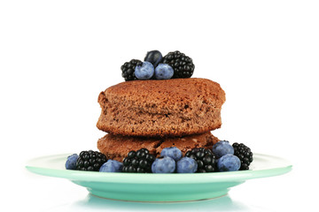 Cake with berries on plate isolated on white