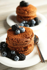 Cakes with berries on the table