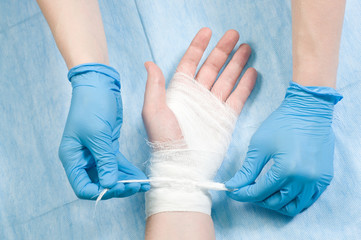 Doctor bandages hands