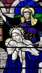 Mary with baby Jesus and Joseph in stained glass