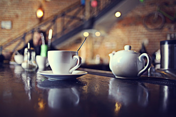 cup of tea at a cafe blurred background