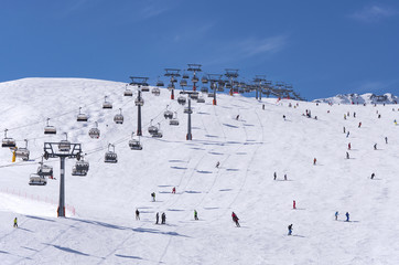 Fototapeta na wymiar Skiers and chairlifts in Solden, Austria