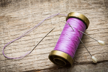 needle and purple thread