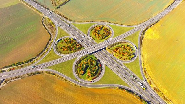 Aerial view to traffic on highway D5 interchange nearby Pilsen, Czech republic, Central Europe. Transportation in rural landscape. Environmental concept. 