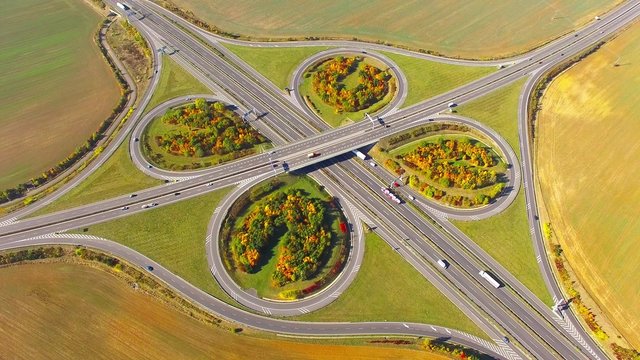 Aerial view to traffic on highway D5 interchange nearby Pilsen, Czech republic, Central Europe. Transportation in rural landscape. Environmental concept. 