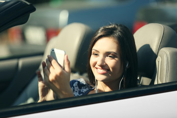 Young woman in the car outside