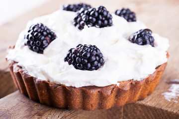 Tartlets with blackberries.selective focus